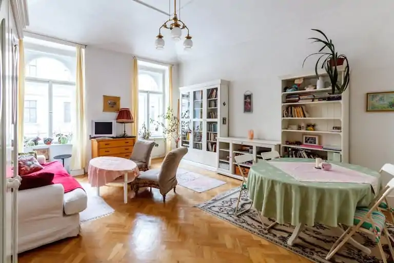 Bright and airy living room with classic vintage decor, perfect for Google Meet or Zoom backgrounds.